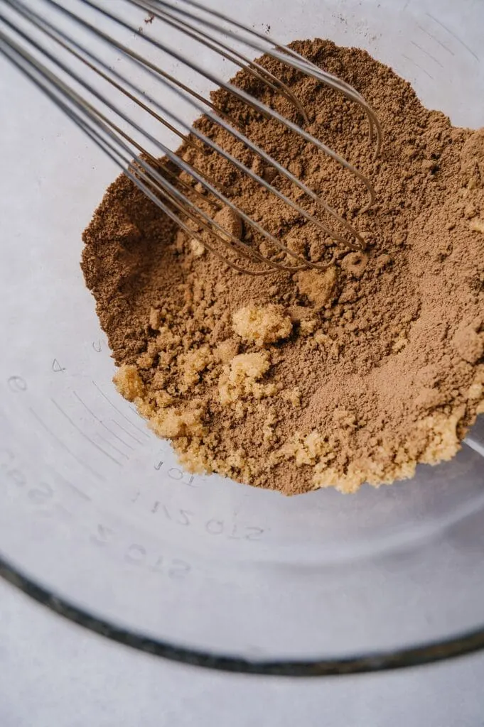 mixing ingredients for chocolate ice cream in a bowl