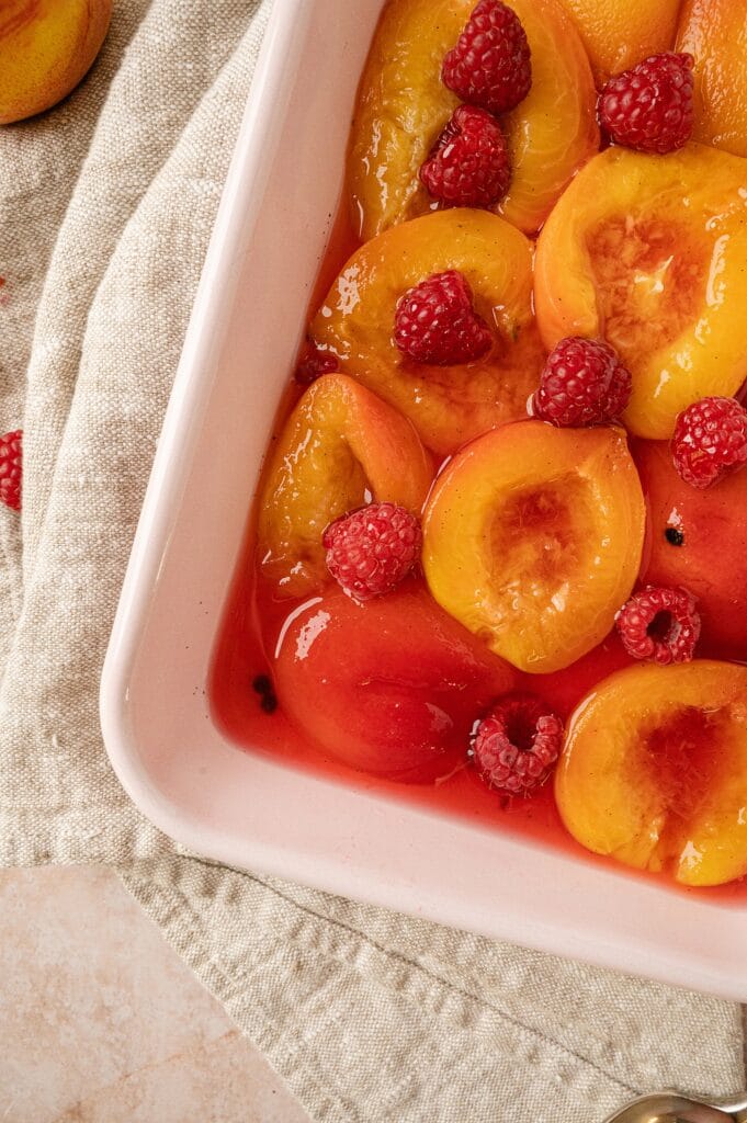 close up of casserole dish of poached peaches