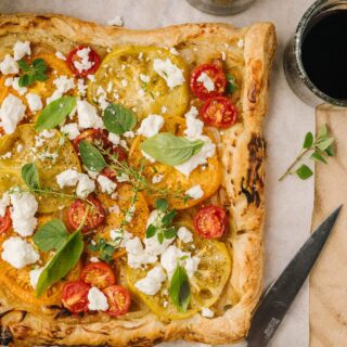tomato and feta tart on parchment paper