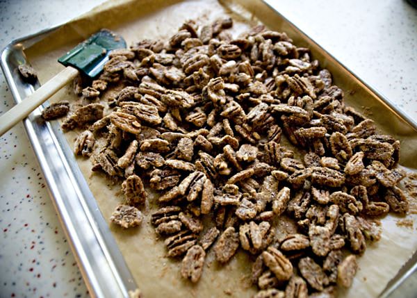 candied pecans on a baking sheet
