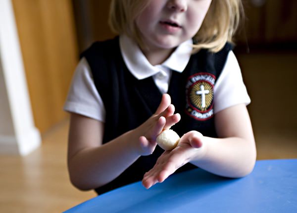 little girl with blonde hair making Irish candy