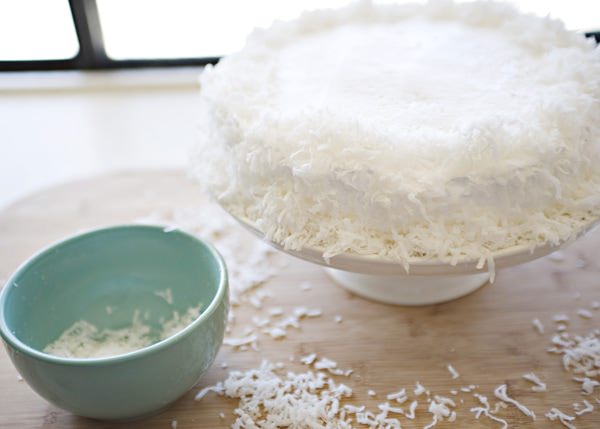7 minute frosting with shredded coconut on a cake