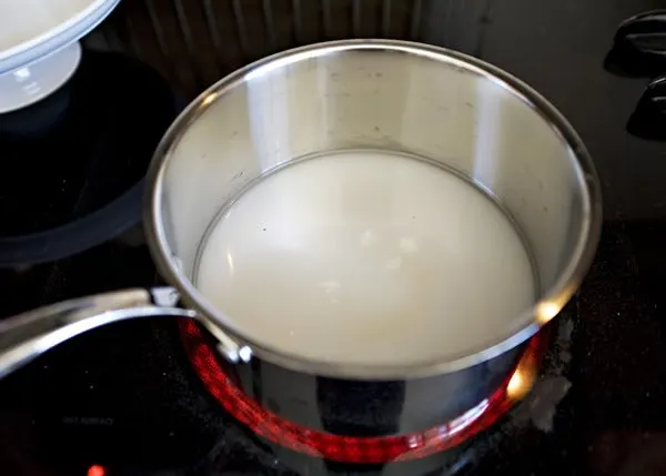 hot sugar syrup cooking in pan on stove top