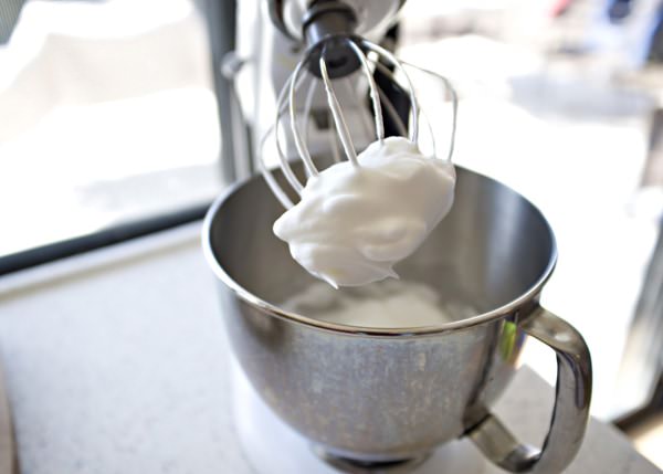 fluffy white meringue in mixing bowl