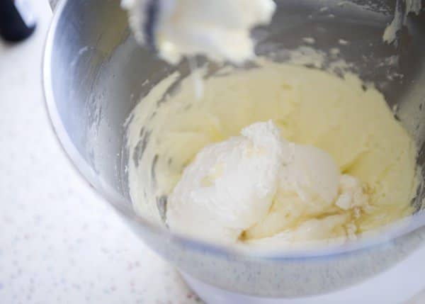 ingredients for marshmallow buttercream frosting in a mixing bowl