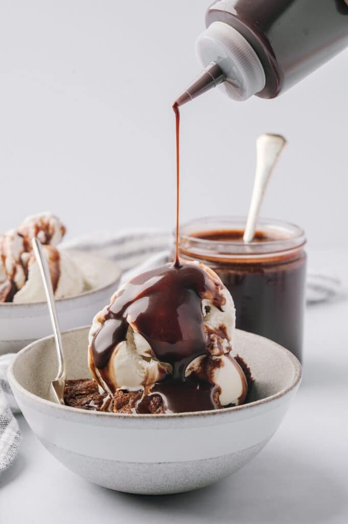 best chocolate sauce being drizzled over a bowl of ice cream