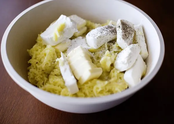 rice potatoes cream cheese butter salt pepper and cream of tartar in a bowl
