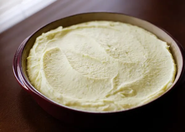 unbaked make ahead mashed potatoes in a casserole dish