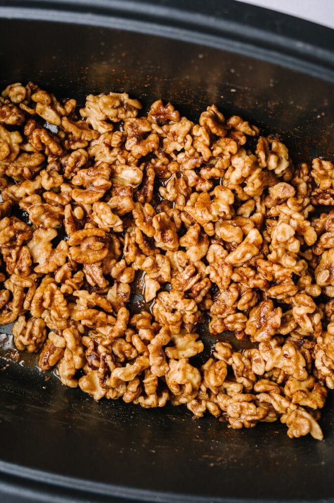 freshly made slow cooker sweet and spicy nuts in the slow cooker