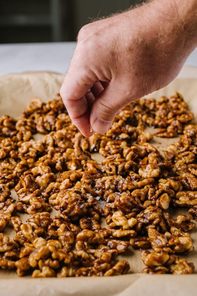 slow cooker sweet and spicy nuts on a plate
