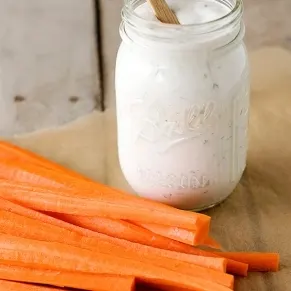 ranch dressing in a jar with carrots