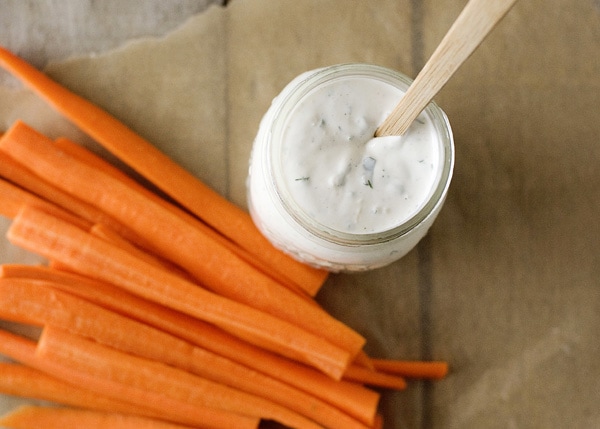 homemade ranch dressing in a jar with carrot sticks