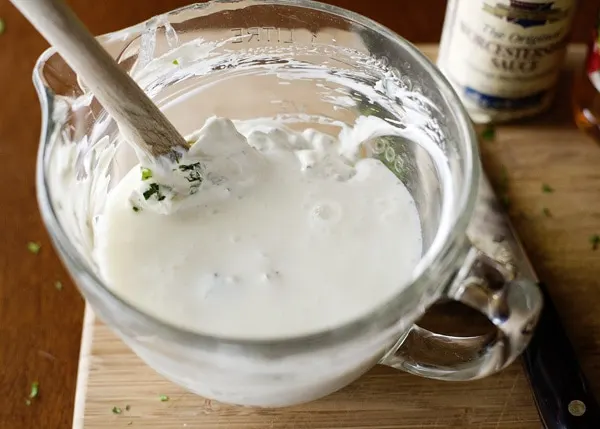 mixing ingredients for homemade ranch dressing recipe