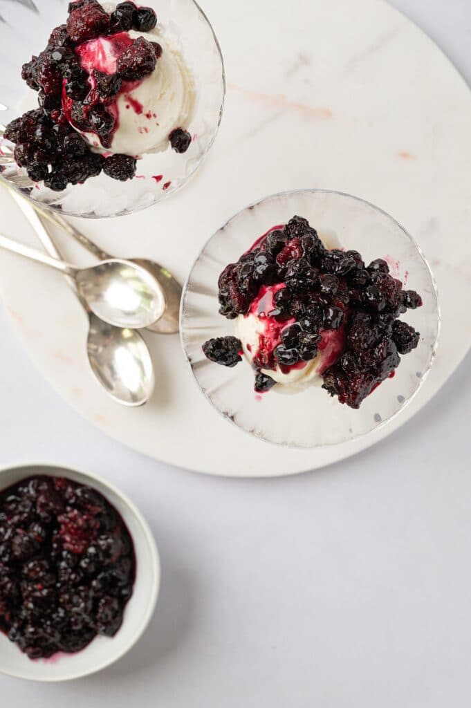 bowls of roasted summer berries over ice cream