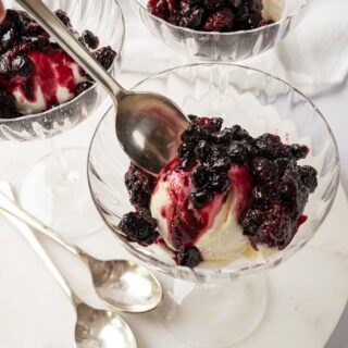 bowl of roasted summer berries over ice cream