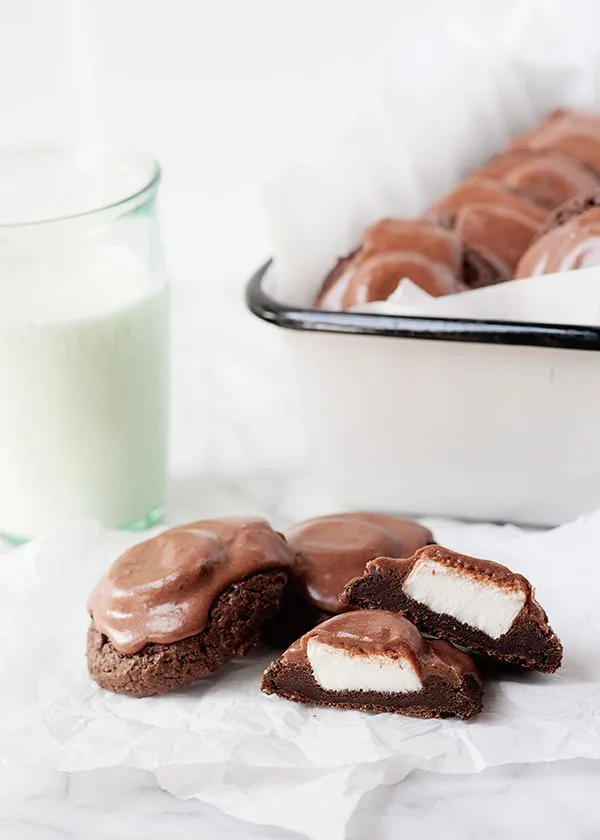 surprise cookies on a counter with a glass of milk