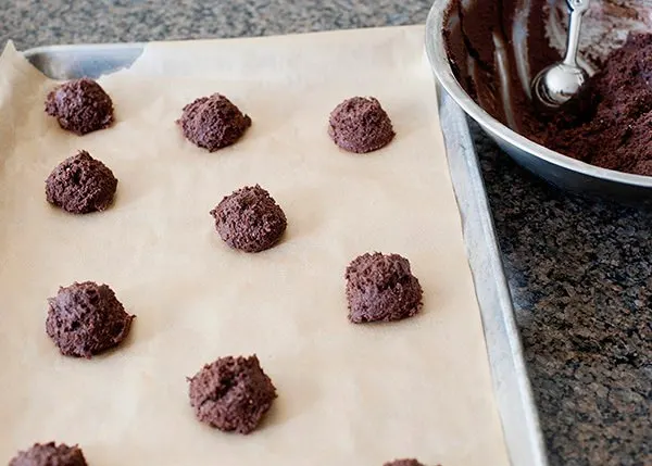 surprise cookies on a parchment paper lined cookie sheet