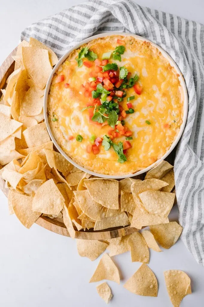 hot corn dip in a bowl with tortilla chips