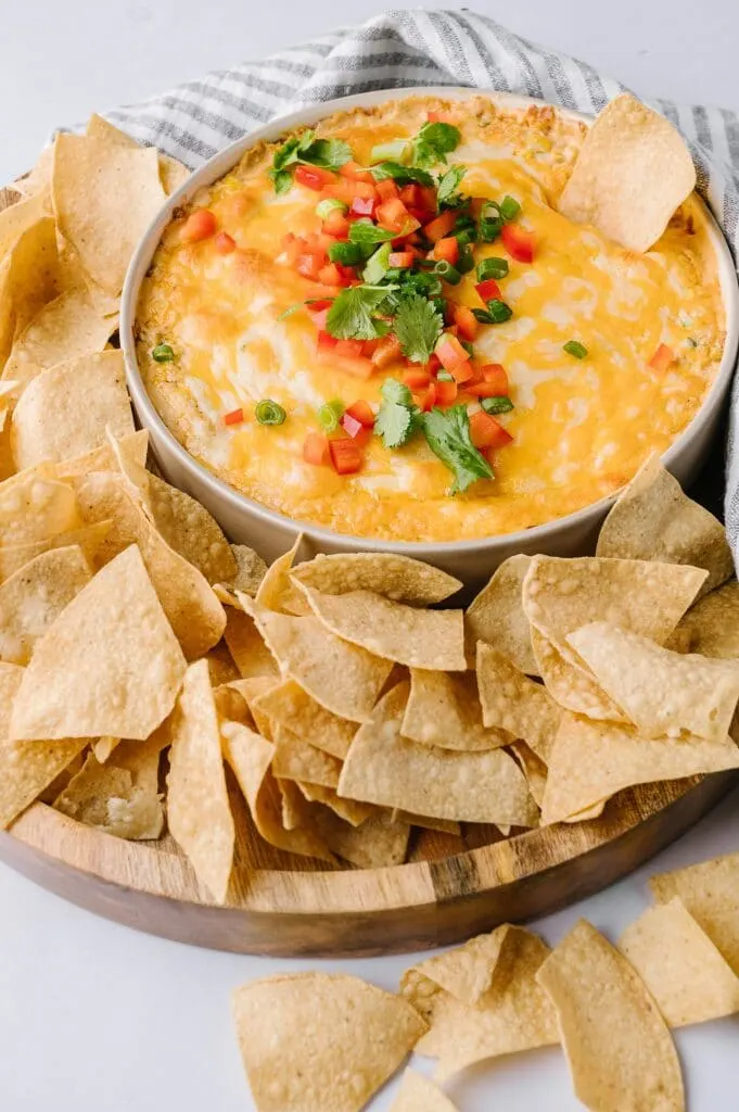 bowl of hot corn dip in a bowl with tortilla chips