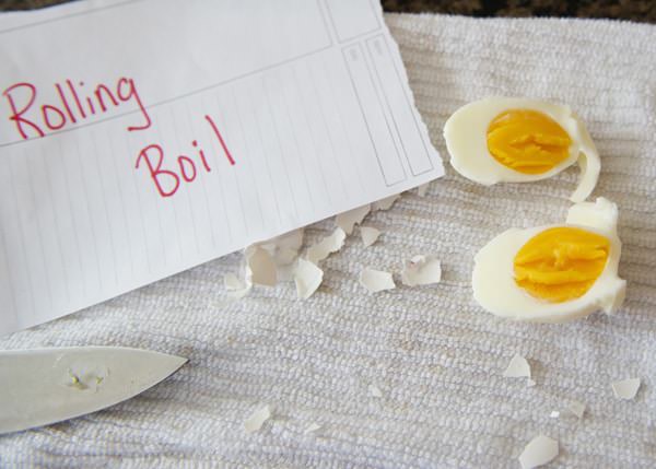 rolling boiled eggs peeled and sliced