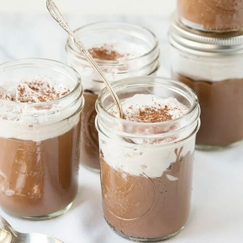 vegan chocolate pudding in a mason jar with a spoon
