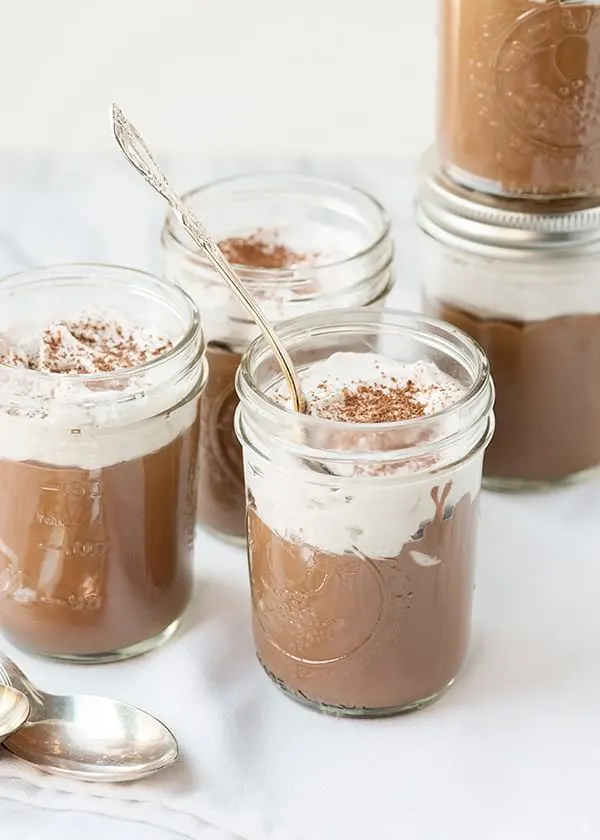 vegan chocolate pudding in a mason jar with a spoon