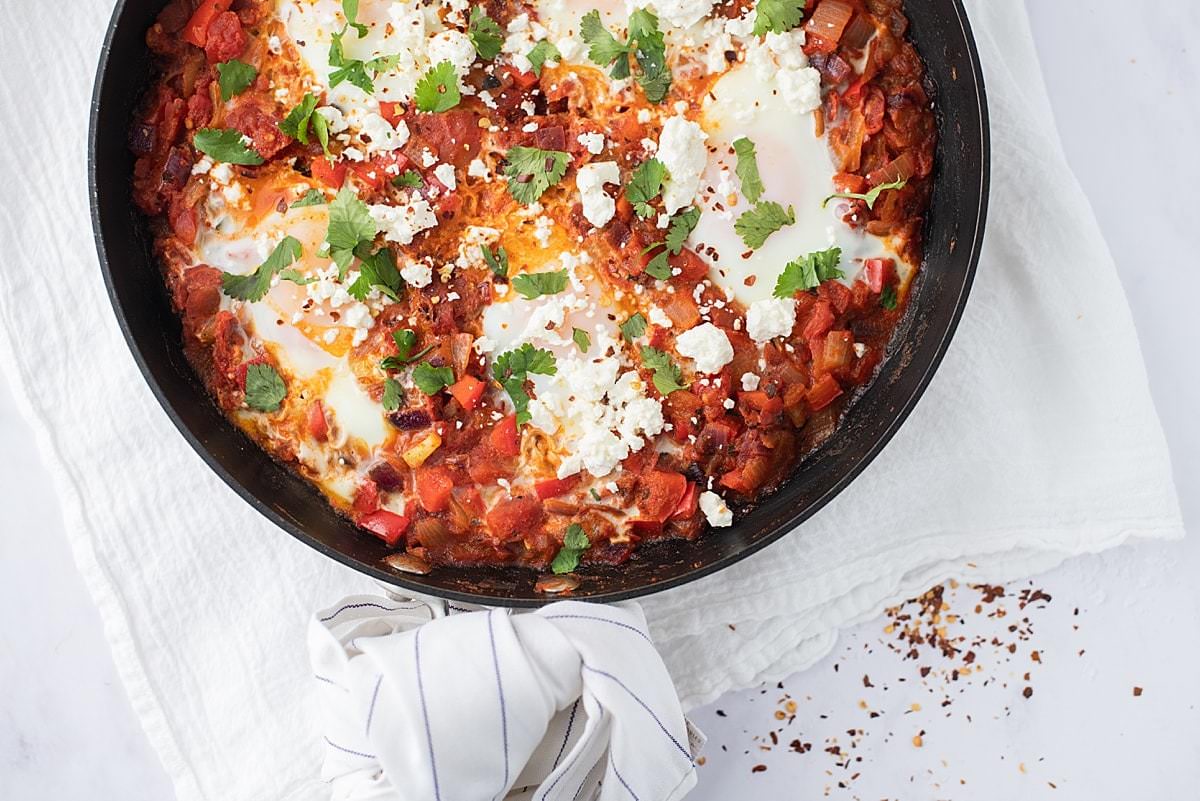 Eggs Baked in Spiced Tomato Sauce with Feta Cheese - A shakshuka recipe 
