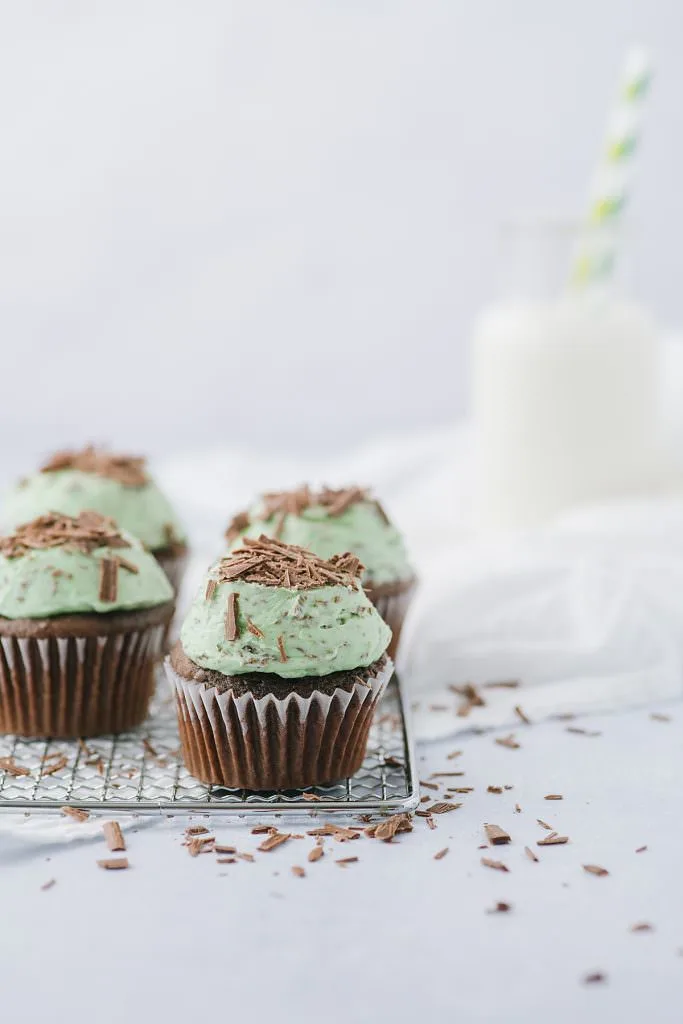 mint chocolate chip cupcakes and a bottle of milk