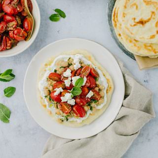 tomatoes and flatbread on a plate