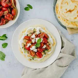 tomatoes and flatbread on a plate