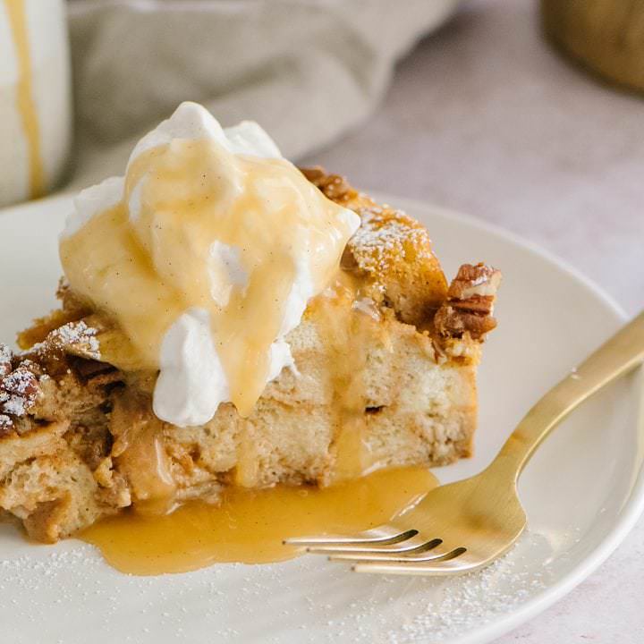Pumpkin Bread Pudding on a plate with a gold fork
