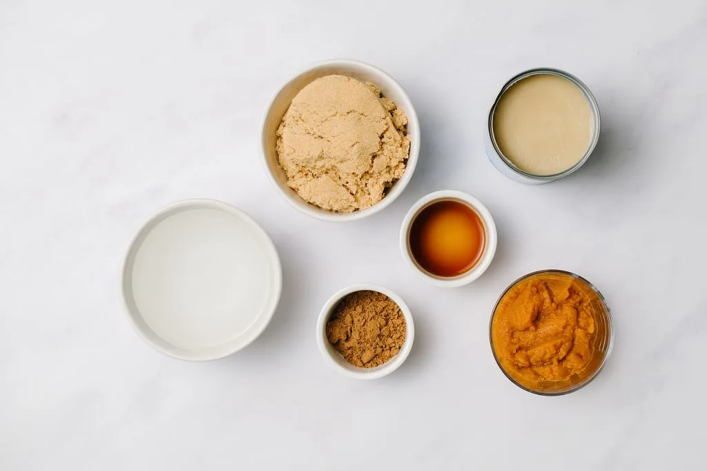 Pumpkin Spice Syrup ingredients in white bowls