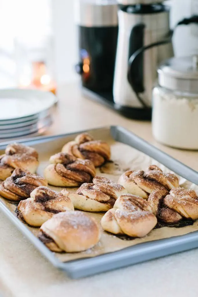 swedish cinnamon buns on a baking sheet