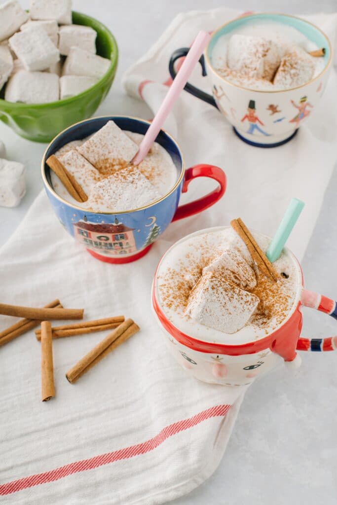 mugs of hot chocolate with cinnamon vanilla marshmallows