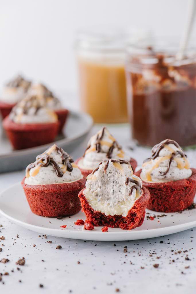 red velvet cheesecake cups with a bite out of one