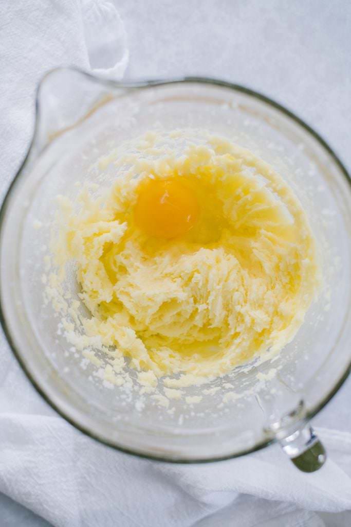 eggs, butter and sugar in clear mixing bowl
