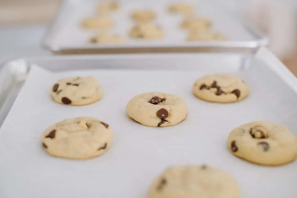 chocolate chip cookies on parchment-lined baking sheet