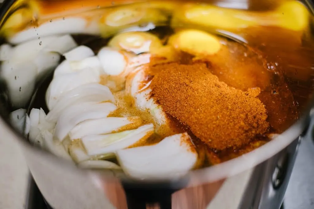 lemons, onions and Old Bay seasoning in large stockpot with water
