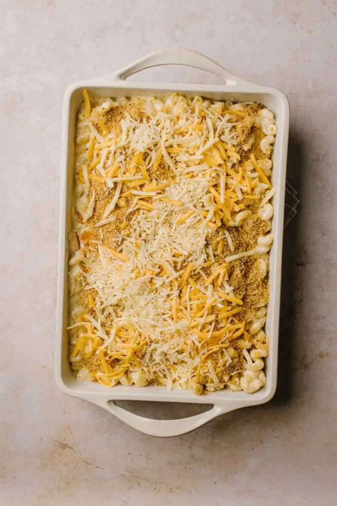 breadcrumb and cheese topped macaroni and cheese in white casserole dish