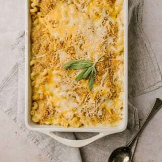baked squash and sage macaroni and cheese in white baking dish