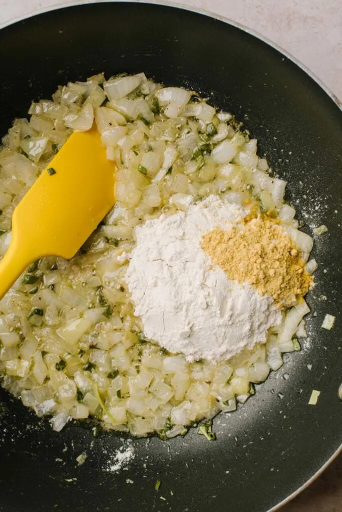 sauted onions and garlic with flour and dry mustard in skillet
