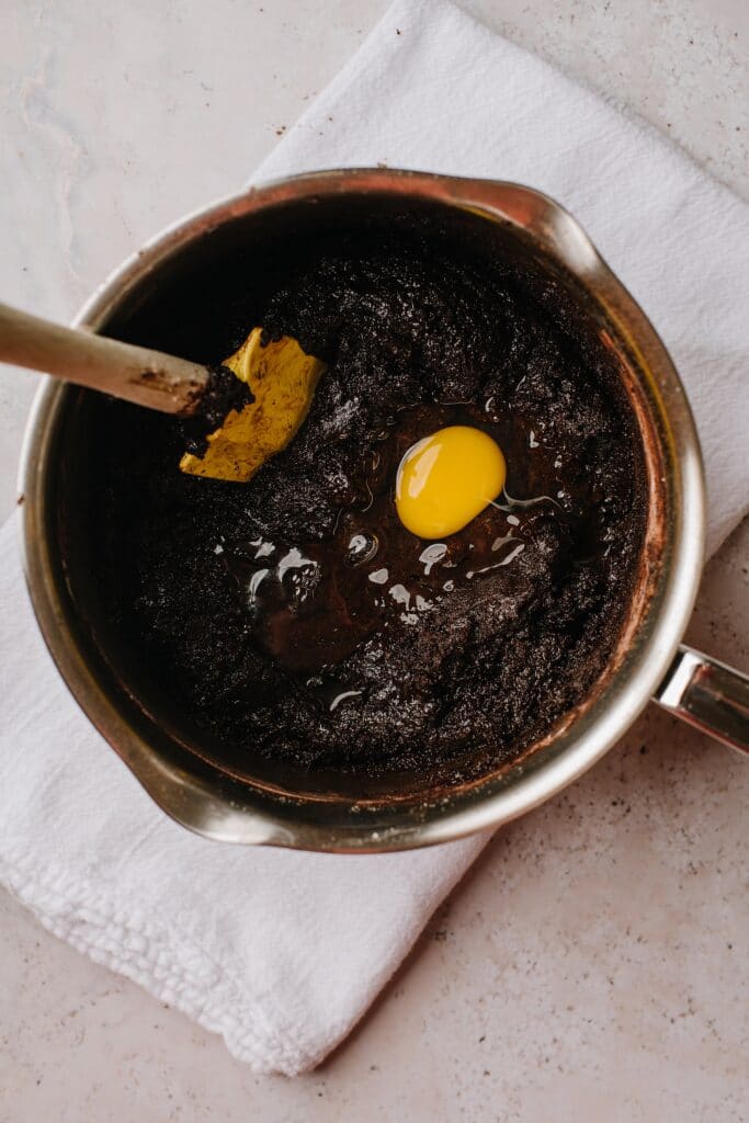 egg and cocoa powder mix in saucepan
