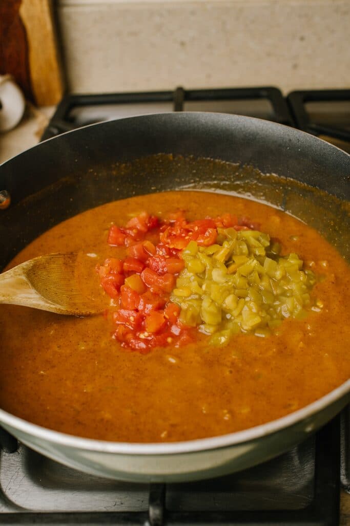 diced tomatoes and green chiles in onion stock in skillet