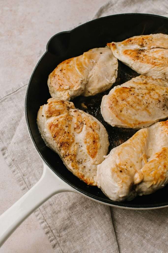 seared chicken breasts in cast iron skillet