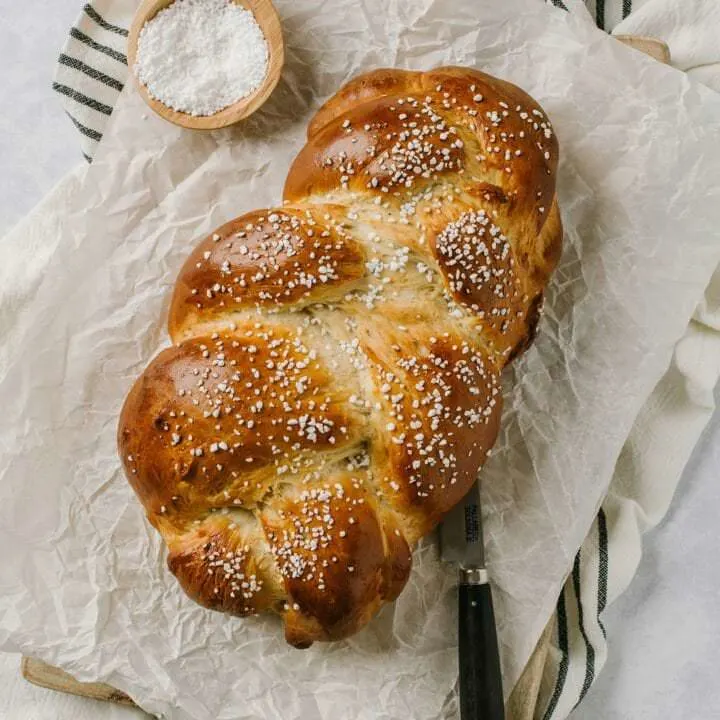 easy finnish pulla recipe with knife and pearl sugar on the side