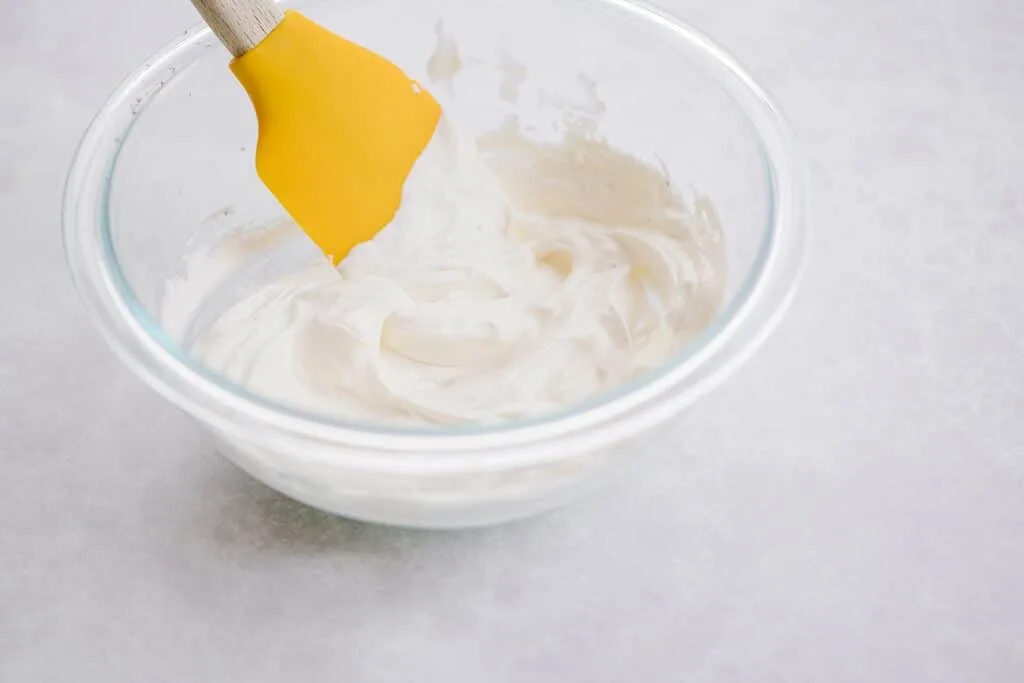 bowl of Hood Sour Cream with yellow spatula