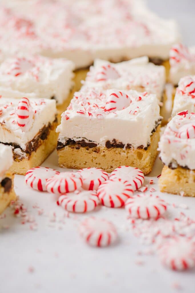 Peppermint White Chocolate Bars, sliced and surrounded by peppermint candies