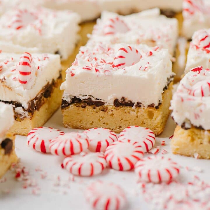 Peppermint White Chocolate Bars, sliced and surrounded by peppermint candies