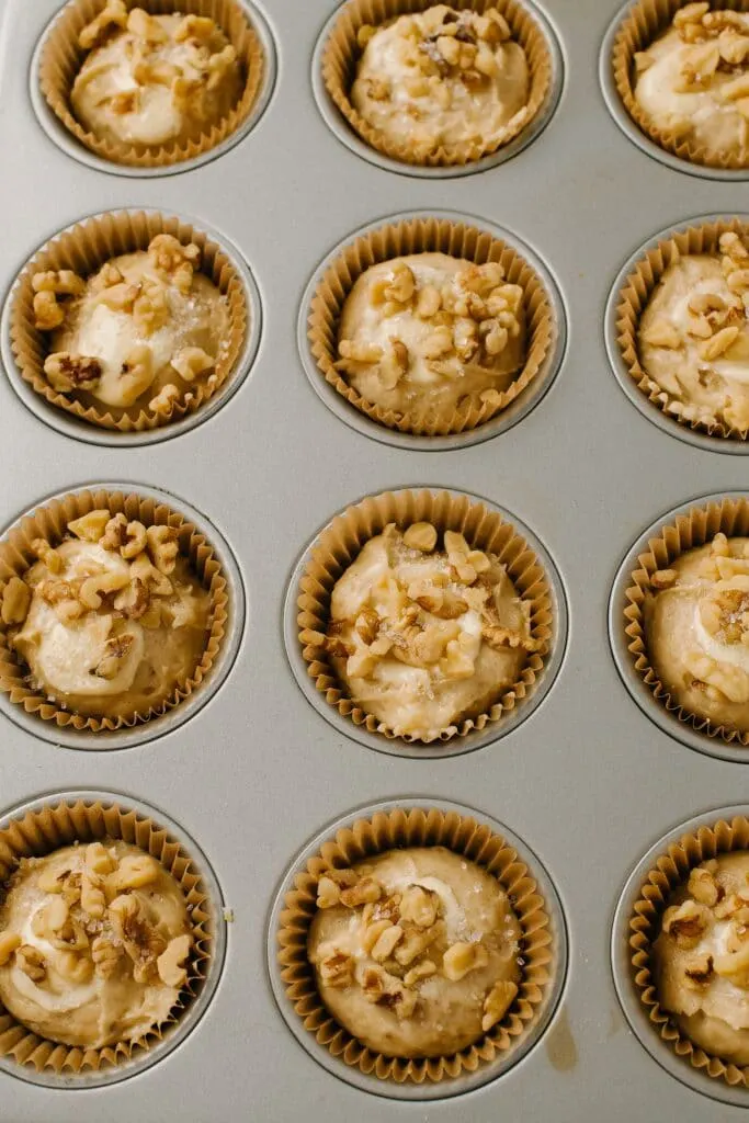 topping banana muffins with walnuts