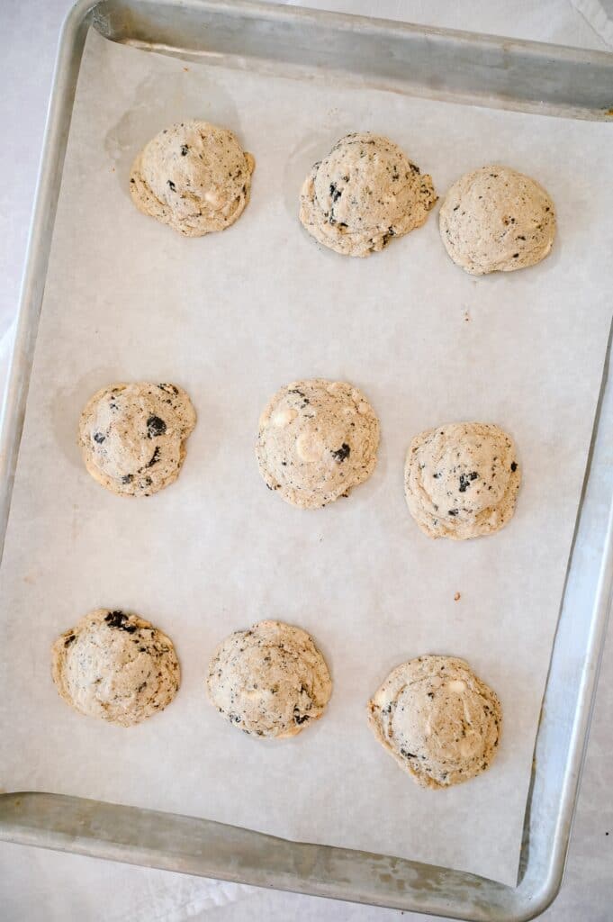 scooped cookies and cream pudding cookies dough on a cookie sheet